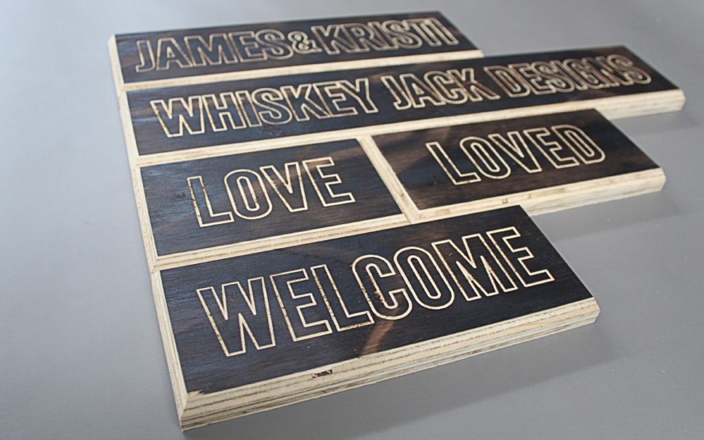 Whiskey Jack - torched plywood with lightly engraved lettering