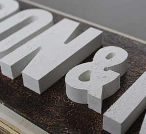 Don & Nancy - plywood with textured panel of ACM and 1/2" thick PVC raised letters with white textured surface