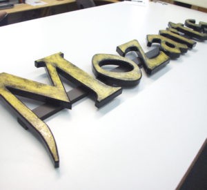 Mozarts - MDO plywood letters with textured gold painted finish