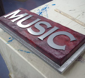 Music - hard-coated styrofoam with brushed aluminum ACM letters