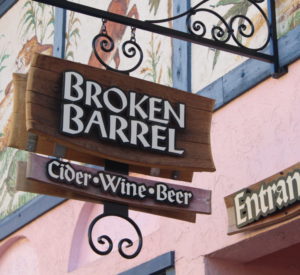 Broken Barrel - background made of wine barrel staves, letters are black ACM with white vinyl