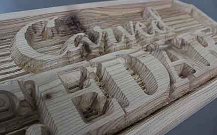 Carved letters into wood