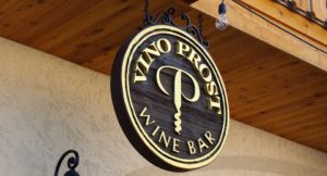Vino Prost - 3" thick cedar sandblasted, "VINO PROST" 1/2" thick PVC letters applied for extra depth