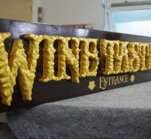 Wine Tasting cedar board stained and clear coated, and hand textured raised gold letters