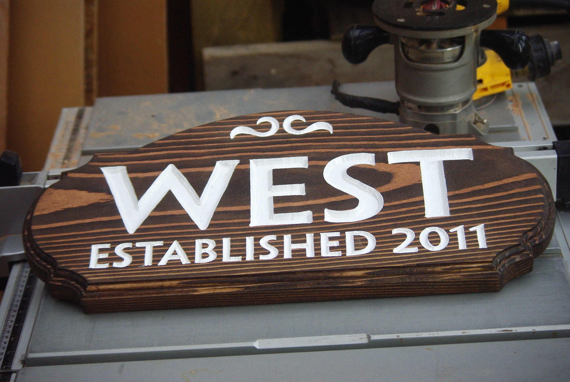 Wooden name sign with carved letters