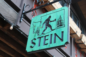 Stein logo carve into wooden sign