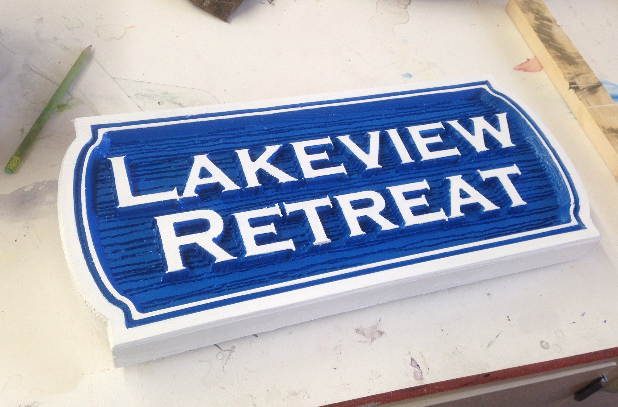 Lakeview Retreat sign with carved wood grain texture