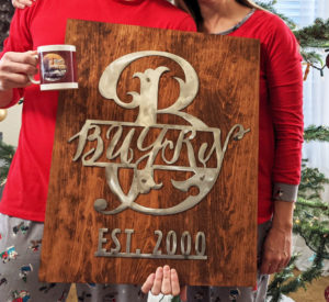 Buyrn - sign with grinded steel on hardwood