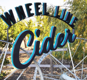 Wheel Line Cider - sign with cut out letters