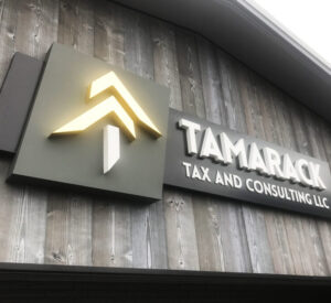 Tamarack Tax sign on wood wall made of high density urethane