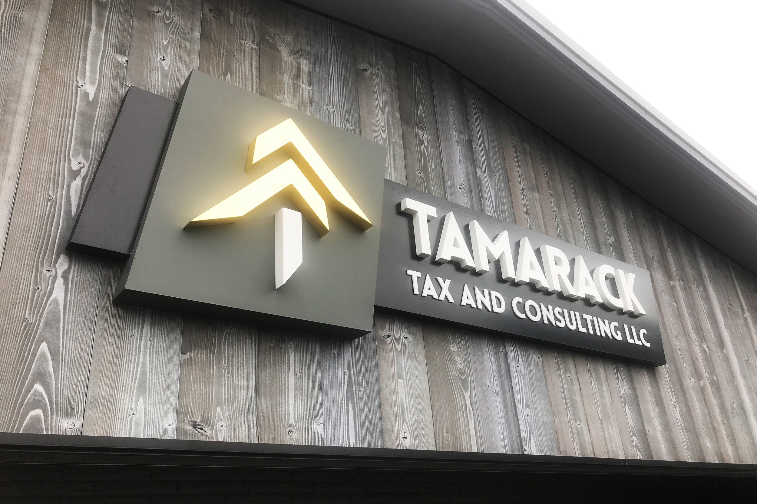 Tamarack Tax sign on wood wall made of high density urethane