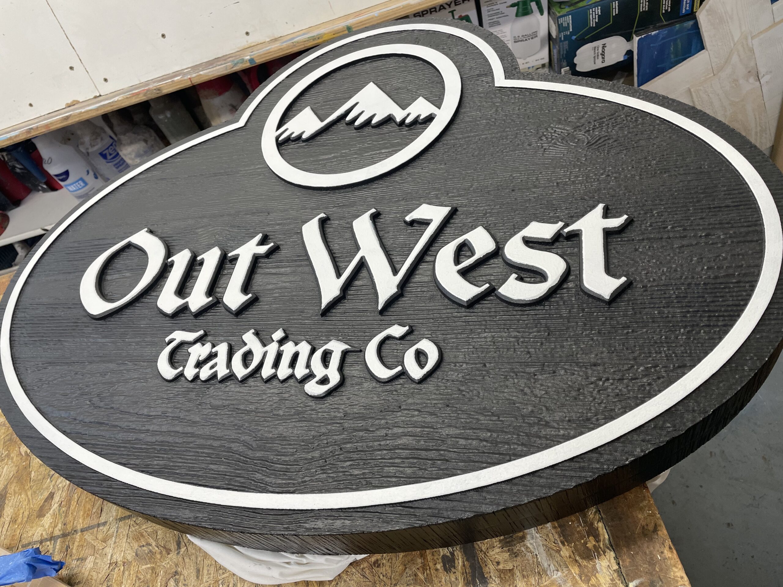 Black and white sign with wood grain texture