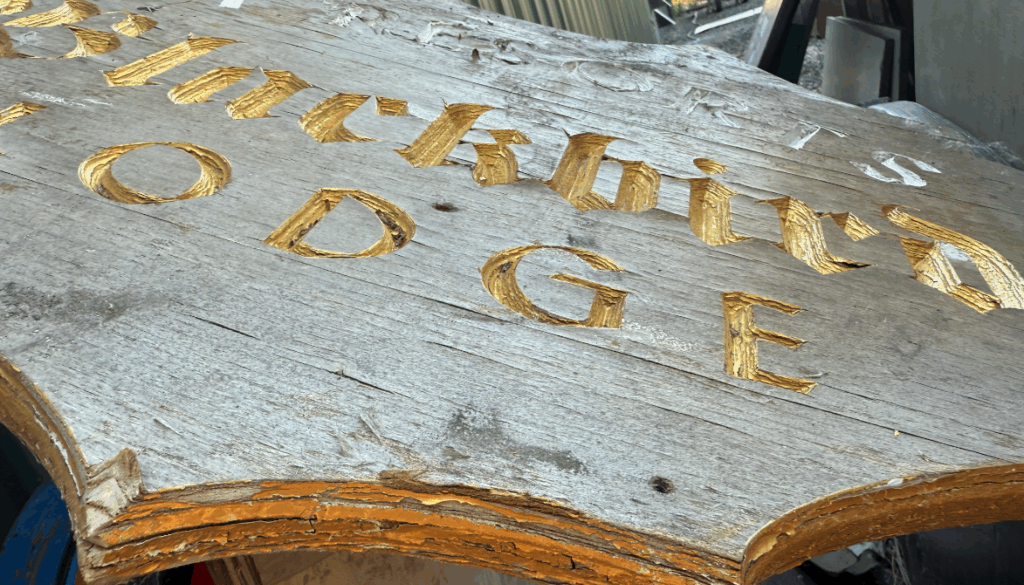 aged edges of a plywood sign